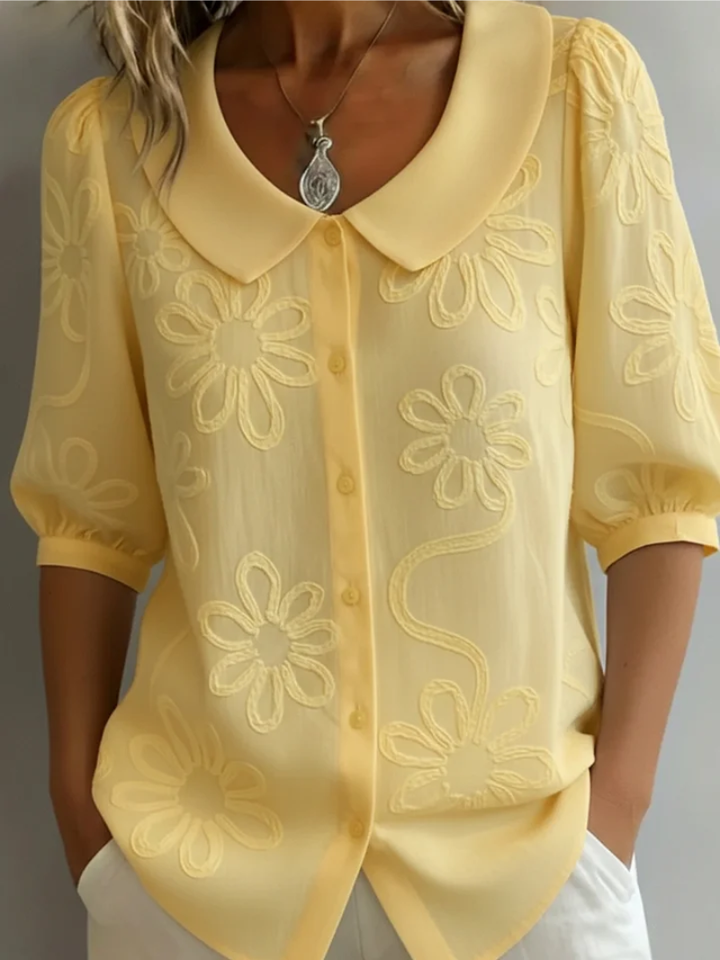 Sara – Blusa con fiori ricamati