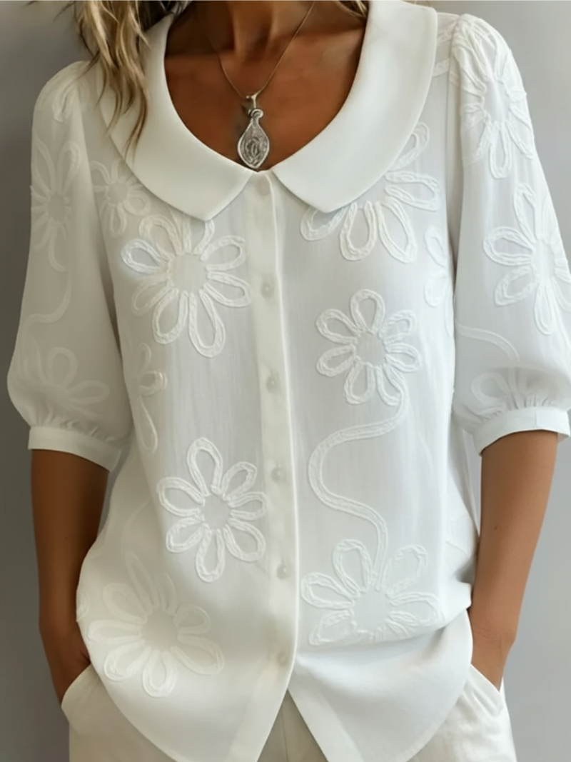 Sara – Blusa con fiori ricamati