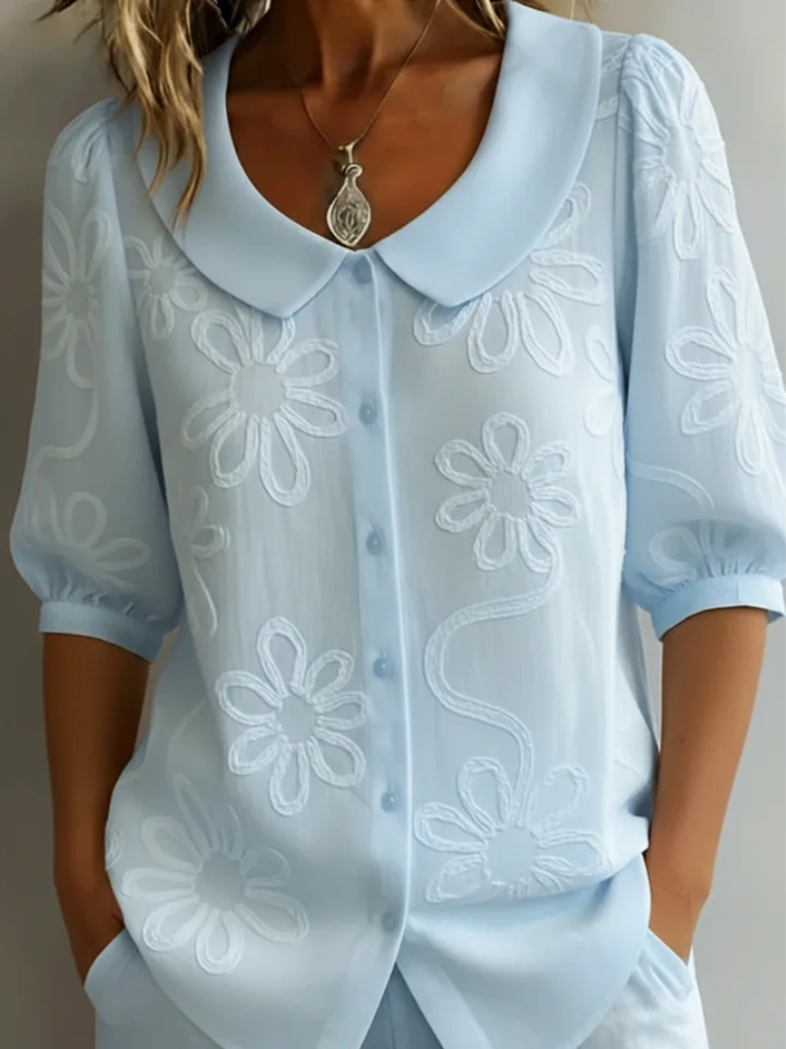 Sara – Blusa con fiori ricamati